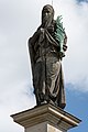 Deutsch: Statue auf dem Giebel der Nordfassade des Deutschen Doms in Berlin-Mitte. This is a photograph of an architectural monument. It is on the list of cultural monuments of Berlin, no. 09065016.