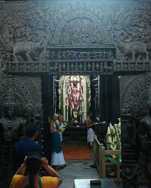 Devotees offering prayers at the garbhagriha in Chennakeshava Temple, Belur, which houses the icon of the god Vishnu.