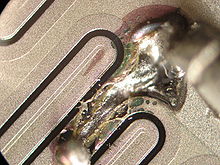 Micro-photograph of a failed TO3 power transistor due to short circuit Failed transistor.jpg