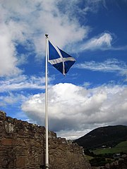 The Saltire, the national flag of Scotland: A white (argent) saltire on a blue (azure) field.