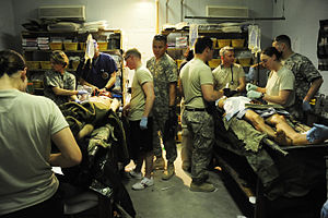 Traumatic injuries, like those from improvised explosive devices, leave large open areas contaminated with debris that are vulnerable to becoming infected with A. baumannii. Flickr - The U.S. Army - Soldiers receive treatment for IED injuries.jpg