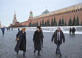 Truss, amongst others, walking in Red Square in Moscow
