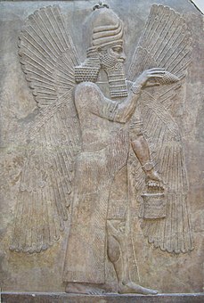 Relief with a winged genie with bucket and cone; 713-706 BC; height: 3.3 m; Louvre