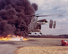 HH-43B on a firefighting exercise in the 1960s. The helicopter had an especially strong downwash that could blow the smoke away from the firefighters HH-43B Huskie during a firefighting exercise c1960s.jpg