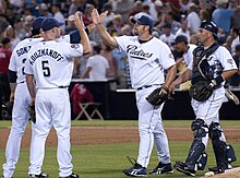 Heath Bell is congratulated by San Diego Padres teammates after a save in 2009 Heath Bell congratulated after save.jpg