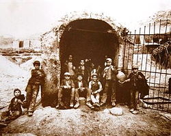 Carusi (boys) before a sulfur mine, 1899 (Photo: Eugenio Interguglielmi) Interguglielmi, Eugenio (1850-1911) - Sicilia - Carusi all'imbocco di un pozzo della zolfara, 1899.jpg