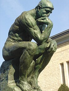 A statue of "The Thinker", has his beliefs been primed or