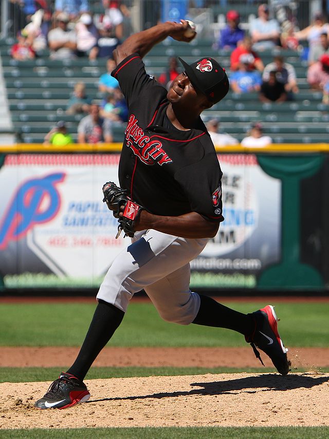 A baseball player in black and gray