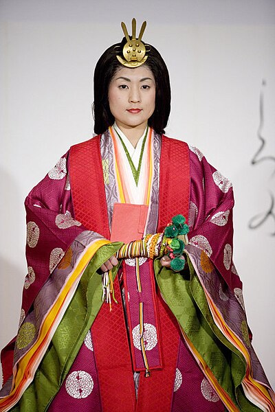 A young woman models a jūnihitoe, a 12-layered formal court dress worn by women during the Heian period, during a demonstration of traditional Japanes