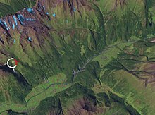 A satellite image of the Kofels landslide showing the debris which flowed into the Otztal valley. It is estimated that around 3 km of material were displaced during this slide about 9800 +- 100 years ago. Kofels Landslide.jpg