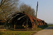 This ruined Nissen Hut is on North End Place Farm there is some serious rust and wreckage inside