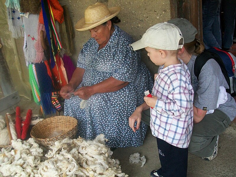 File:Lady Weaving Wool.JPG