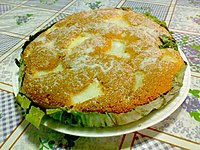 Bibingka, a popular Christmas rice cake with salted egg and grated coconut toppings