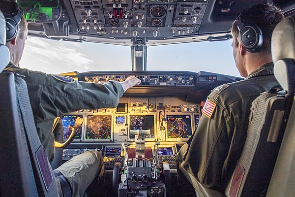 US Navy pilots in the cockpit of a P-8 in 2019