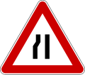 Road narrows on left side