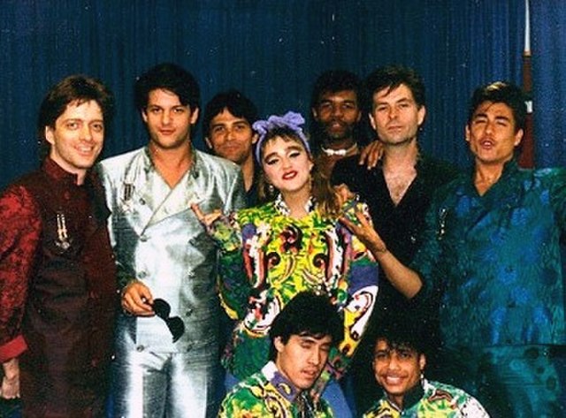 Backstage picture of Madonna and her entourage during the Virgin Tour.