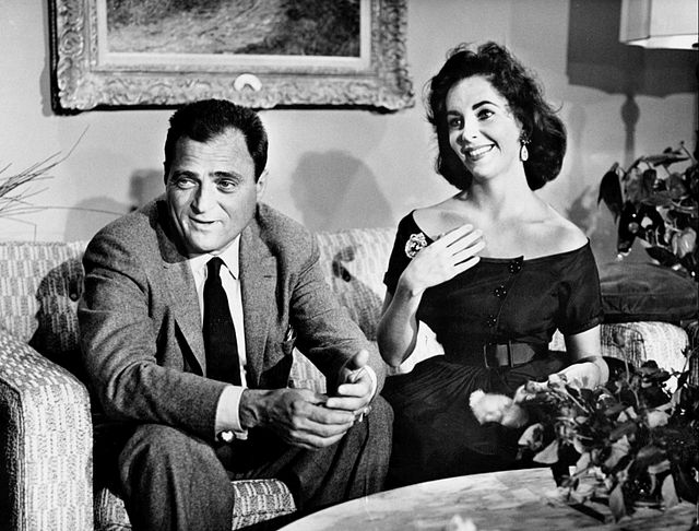 CBS paid Mike Todd for the rights to cover the anniversary celebration as a television special. Todd and his wife Elizabeth Taylor are seen here at ho