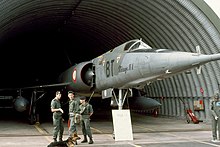 Mirage IV in a hangar with guards Mirage IVA (16811260277).jpg