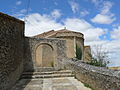 Español: Arco de entrada y ábside de la iglesia de Nuestra Señora de la Asunción (Soliedra).