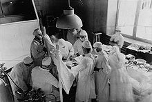 Surgeons Norman Bethune, Arthur Vineberg and Perron assisting Edward William Archibald in an operation, 1933 Norman Bethune operation 1933.jpg