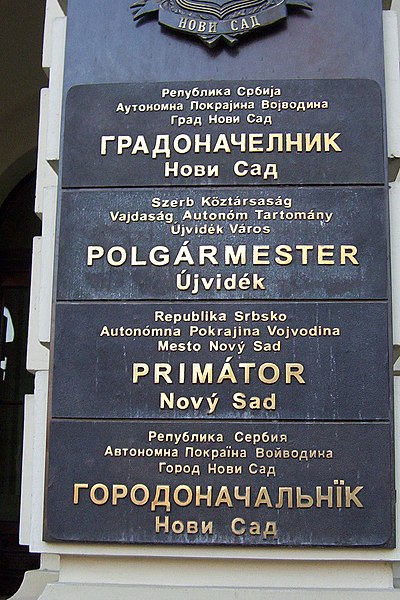 A multilingual sign outside the mayor's office in Novi Sad, Serbia, written in the four official languages of the city: Serbian, Hungarian, Slovak, an