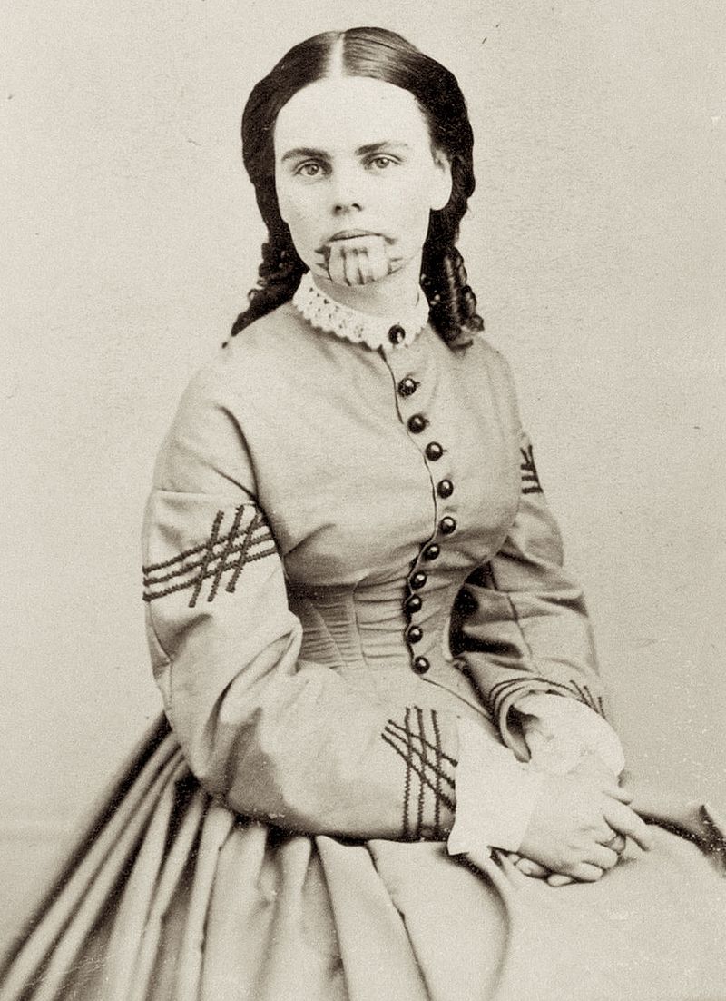 1800s girl with tattooed face