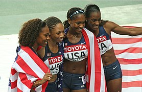American women's 4 × 400 m relay team celebrate.
