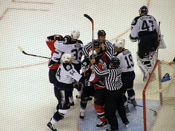 Linesmen attempt to break up a fight around the Tampa Bay goal during the first ice hockey playoff game between the Ottawa Senators and the Tampa Bay 