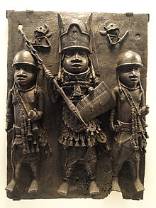 Bronze plaque depicting chief flanked by two warriors, Benin Empire, 1550-1650 AD. African collection, Peabody Museum. Plaque depicting chief flanked by two warriors, Benin, AD 1550-1650 - African collection - Peabody Museum, Harvard University - DSC05790.JPG