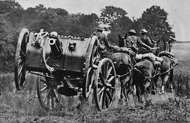 Photo showing 13 pounder gun team galloping into action.