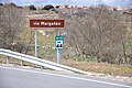 El ríu Margañán so la carretera AV-110 y Cabezas del Villar