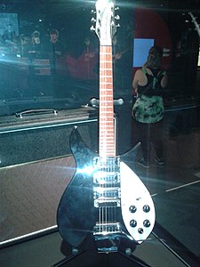 Rickenbacker 325V63, 325C64, or '1990 325JL John Lennon Limited Edition (white pickguard & Kaufmann Vibrola) (similar to John's 2nd '63 325 in 1964) - The Beatles in Montréal - Pointe-à-Callière (2013-06-23 14.16.33 by Patrick Grace).jpg