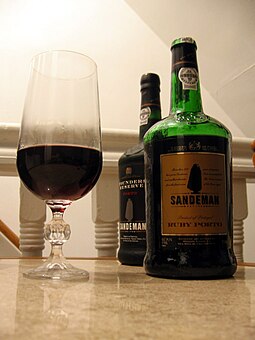 In wines like Port, the addition of neutral grape spirits stuns the yeast and halts fermentation, leaving a wine with a higher proportion of fructose sugars and creating a sweet wine. Sandeman Port 2.jpg