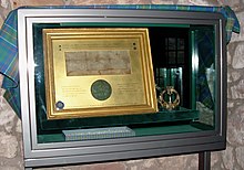 The 1374 Royal Charter and Hunterston Brooch in sealed cabinet in Hunterston Castle Sealed Royal Charter in Cabinet at Hunterston Castle.jpg