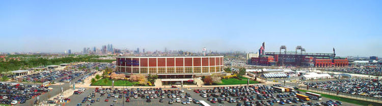 The Spectrum (center) was the oldest (1967) of the four venues which made up the South Philadelphia Sports Complex in this 2004 view from the Wells Fargo Center (1996). Citizens Bank Park (right) is the complex's newest (2004) facility while Lincoln Financial Field (2003) is just out of view to the far right.