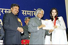 The President Dr. A.P.J. Abdul Kalam presenting the Best Female Playback Singer Award for the year 2002 to Shreya Ghoshal for her soulful rendering of the song 'Bairi Piya' for the film Devdas.jpg