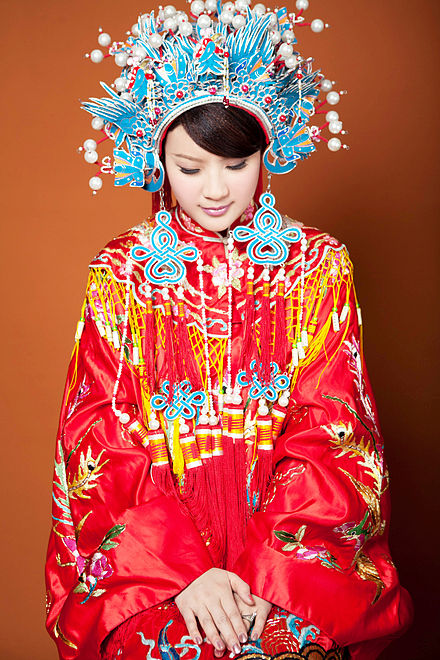 Qing dynasty styled traditional Chinese wedding dress with phoenix crown (鳳冠) headpiece still used in modern Taiwanese weddings.