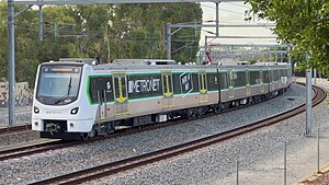 Transperth C-series train between Burswood and Stadium stations, February 2023 08.jpg