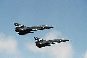 Side view of two delta-wing jet fighters in flight