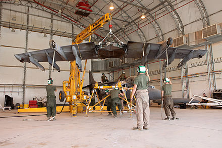 Marines replacing the one-piece supercritical wing of an AV-8B at Camp Bastion, Afghanistan (2012)