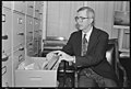 U.S. Representative Donald J. Pease of Ohio going through files in his office.jpg