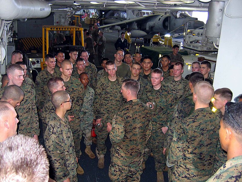 File:US Navy 060219-N-4880C-003 Marines from the 31st Marine Expeditionary Unit (31MEU) are briefed in the ship's hangar bay aboard the amphibious assault ship USS Essex (LHD 2), before going ashore to assist with rescue effo.jpg