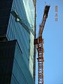 View of 555 Mission Street's facade and crane.