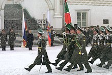 The Federal Border Guard Service of Russia performs a march past Vladimir Putin during the ceremony. Vladimir Putin 21 February 2002-3.jpg