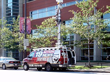 A WOIO electronic news-gathering van (with former 19 Action News signage) in Downtown Cleveland. WOIO CBS 19 Cleveland (1375308680).jpg
