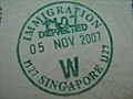 Exit stamp in a Malaysian Passport for leaving Singapore to Johor Bahru via Woodlands Train Checkpoint