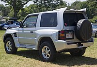 1998 Mitsubishi Pajero Evolution in Munich Silver Metallic, rear left.jpg