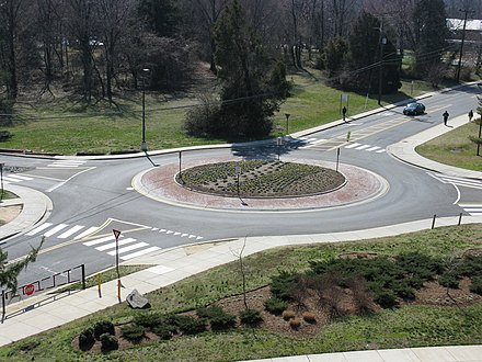 Small modern roundabout in the United States, where vehicles are driven on the right