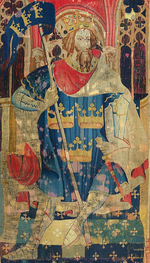 Tapestry showing Arthur as one of the Nine Worthies, wearing a coat of arms often attributed to him, c. 1385