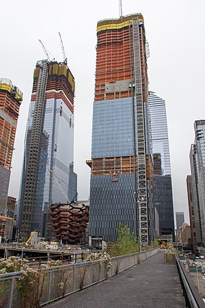 A view from a former railway line up to the skyscrapers of Hudson Yards Redevelopment Project (in construction), with ...